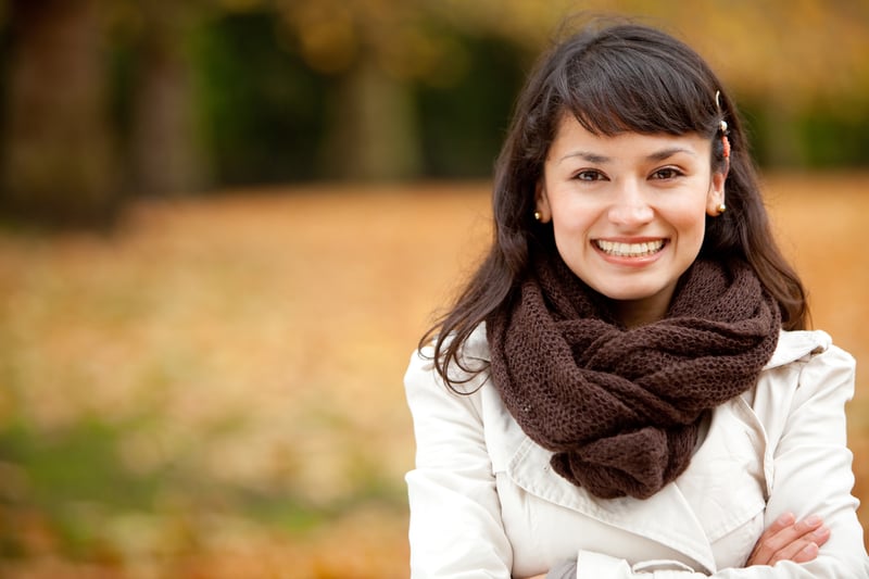 woman smiling in the fall