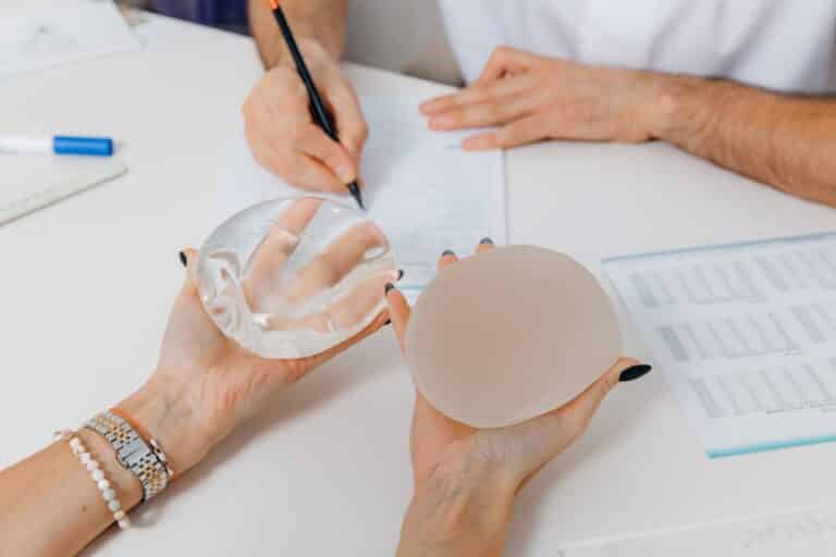 Woman discusses breast implant options with her doctor
