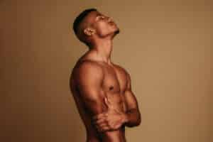 Muscular man, shown in side profile, after a fat transfer procedure